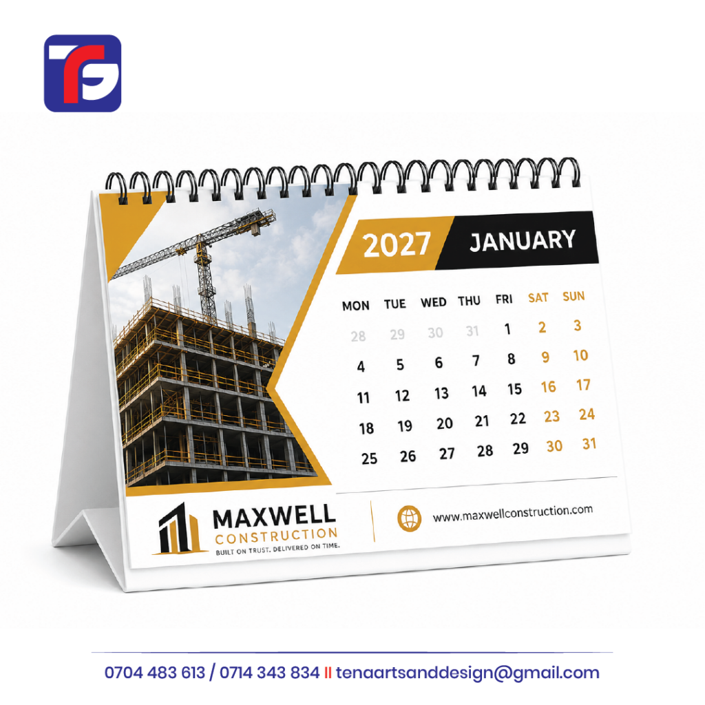 Spiral-bound 2027 desk calendar with a construction site photograph and gold and black branding.