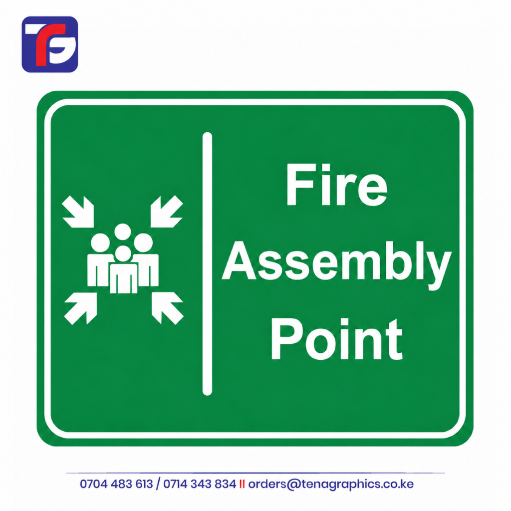 Custom printed oversized A1 size green and white "Fire Assembly Point" emergency signboard featuring the universal evacuation gathering symbol with four inward-pointing arrows by Tena Graphics EA Ltd in Nairobi, Kenya.