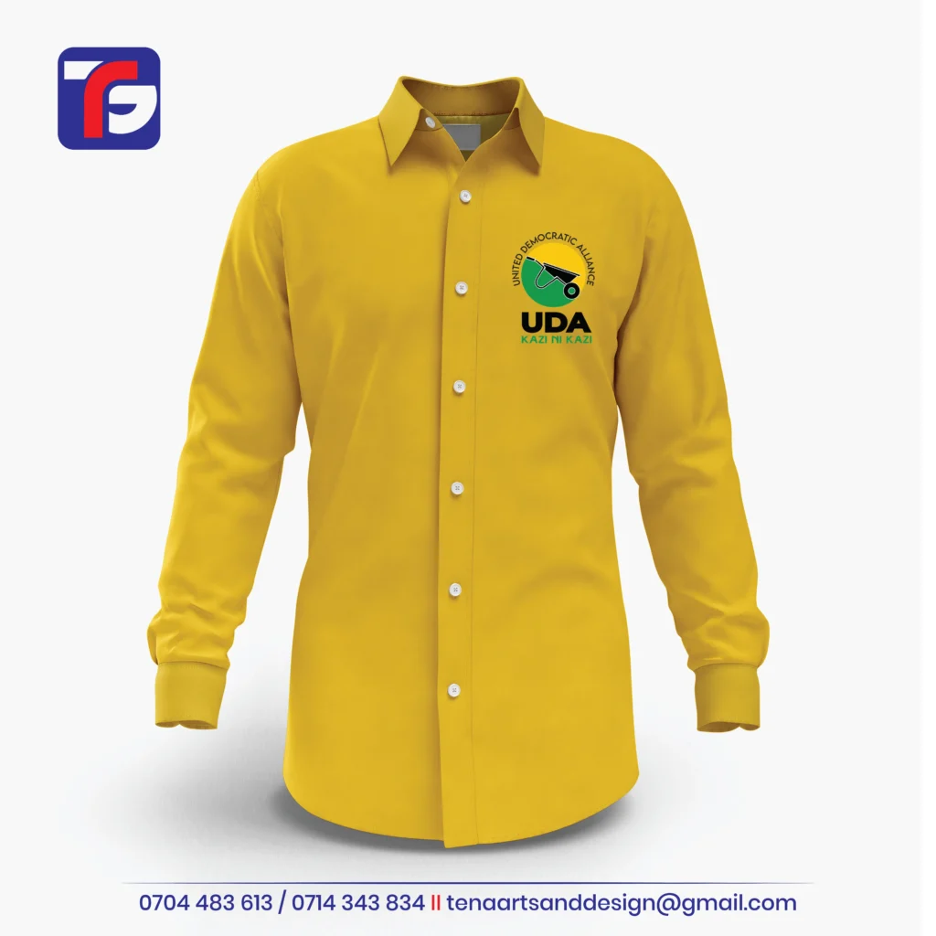 Yellow UDA corporate shirt with long sleeves, white buttons, wheelbarrow chest logo and green KAZI NI KAZI wording.
